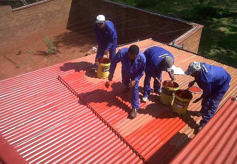 Professional roof repair team working on a Nairobi residential roof